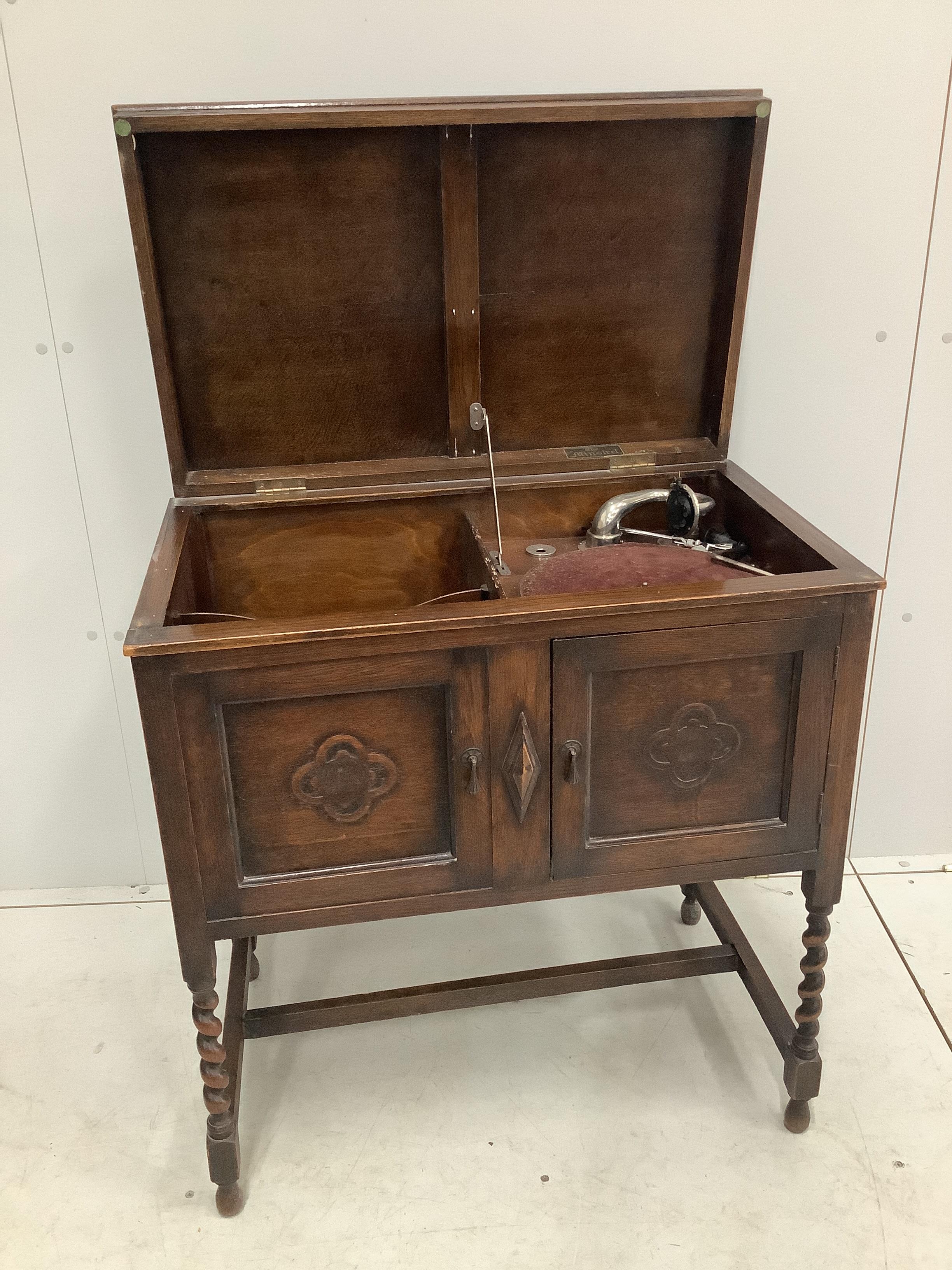 An early 20th century oak cased wind-up gramophone 'The Minstrel', width 74cm, depth 46cm, height 82cm, together with a small quantity of 78 rpm records